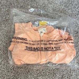 Kyte button front sleeveless romper